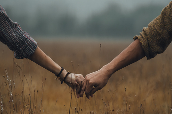 Couple holding hands